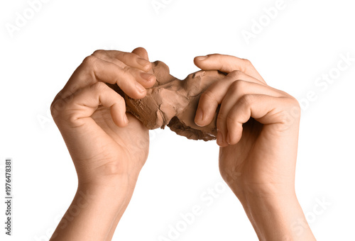 Female hands with clay on w...