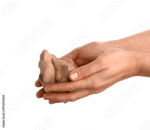 Female hands with clay on w...