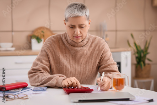 Mature woman in debt using ...