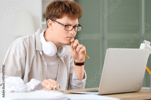 Thoughtful young man workin...