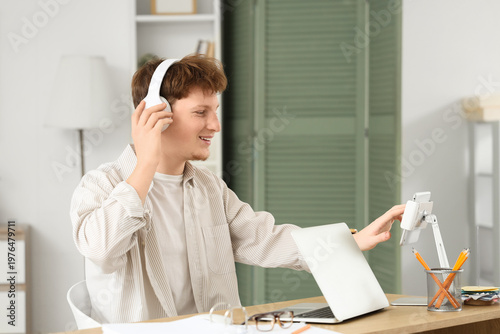 Young man in headphones wor...