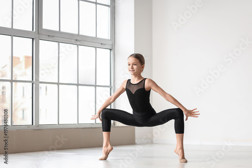 Cute girl doing gymnastics ...