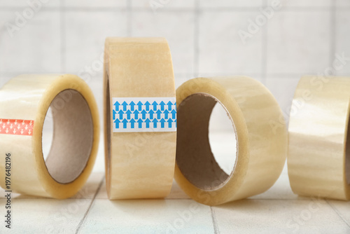 Adhesive tape rolls on ligh...