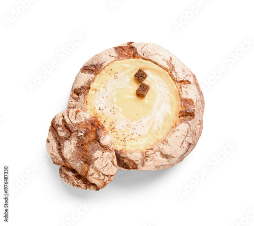 Cheese soup in bread bowl o...