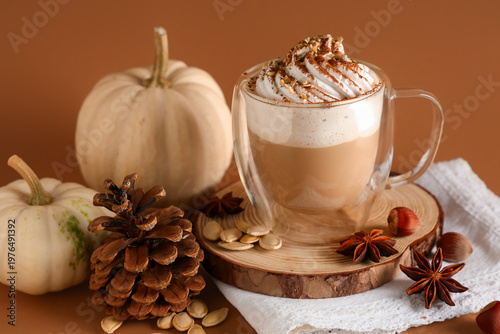 Glass cup of hot pumpkin la...