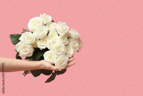 Woman's hands holding bouqu...