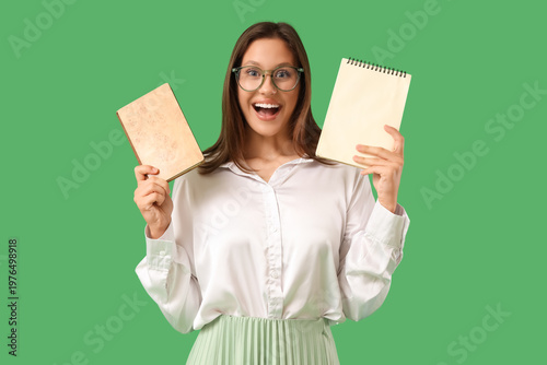 Young woman with notebooks ...