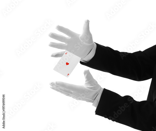 фотографія Male magician's hands with levitating playing card on white background