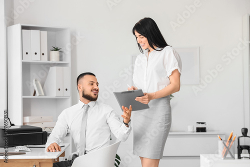 Young secretary showing doc...