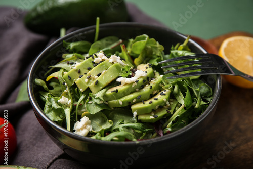 Bowl of tasty avocado salad...