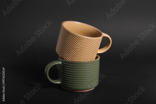 Different ceramic mugs on b...