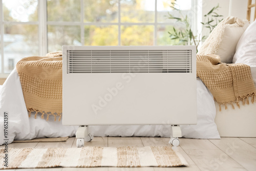 Fotografie Electric convector heater in bedroom