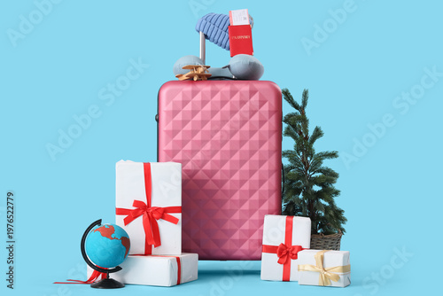 Suitcase with winter and tr...