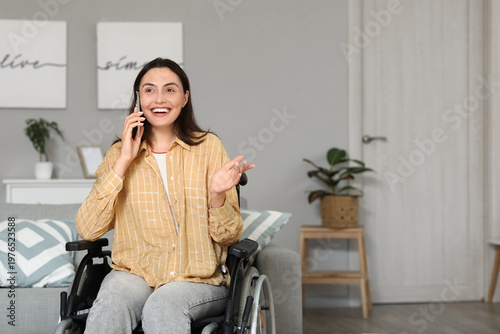 Young woman in wheelchair t...