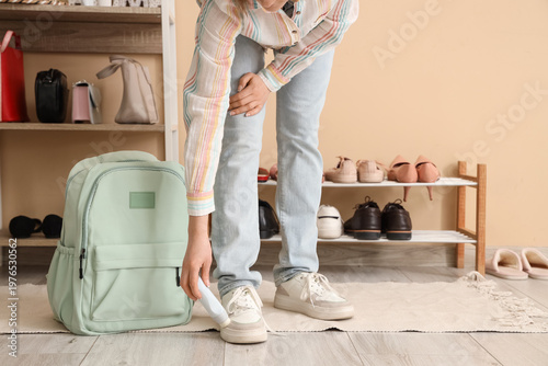 Woman in stylish sneakers w...