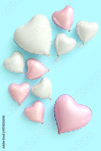 Many heart shaped air balloons on blue background. Valentine's day celebration