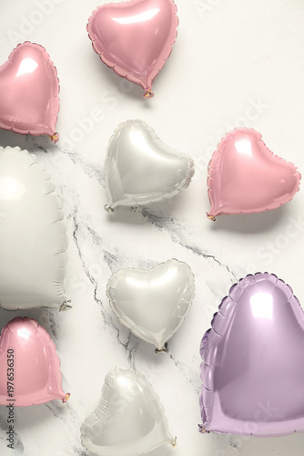 Many heart shaped air balloons on white background. Valentine's day celebration