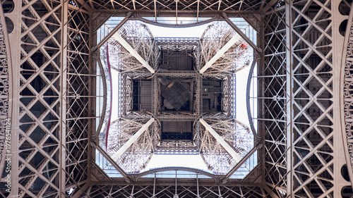 Valokuva Eiffel Tower from below with intricate iron lattice and geometric symmetry in sp