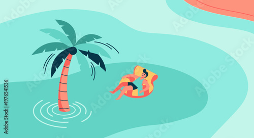 Person relaxing on inflatable raft near palm tree.
