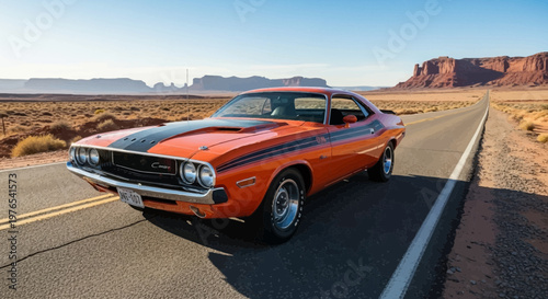 Vintage Orange Dodge Challenger Driving on Desert Road.