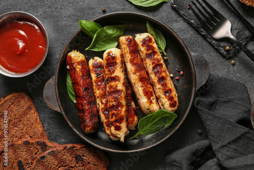 Grilled sausages in cast ir...