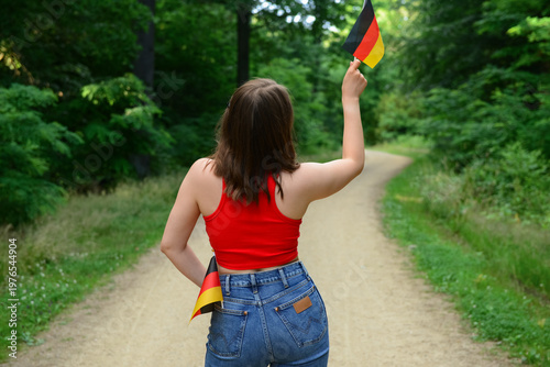 Young woman with flags of G...