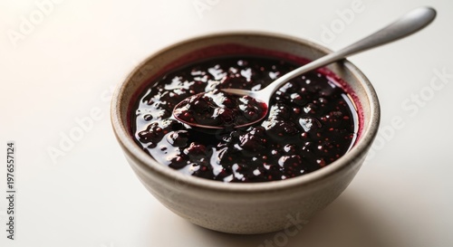 Delicious Homemade Blueberry Jam in a Bowl with a Spoon.