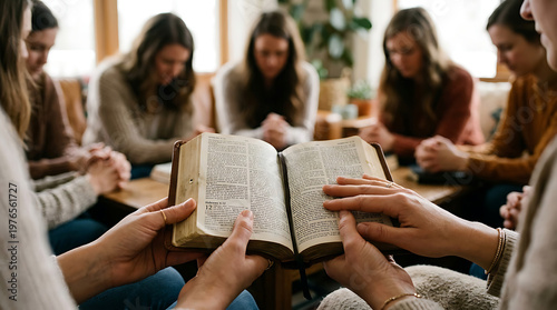 Group of Women Praying Together Around an Open Bible