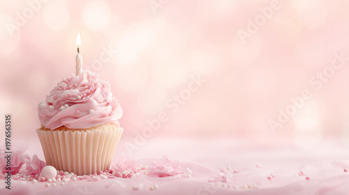 pink cupcake with candle