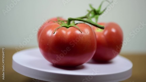 Tomato on Rotating Display: Close-up Showcase of Fresh Produce