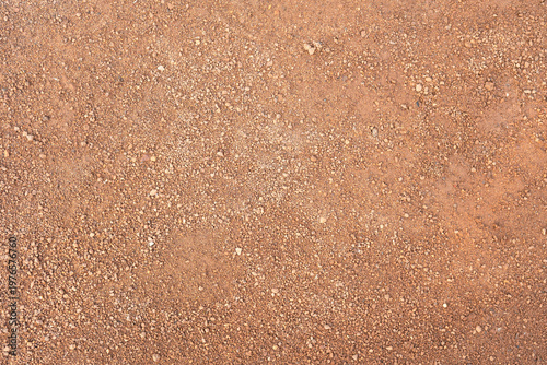Dirt, terrain or gravel stone road surface pattern in outdoor environmental. Background and textured photo.