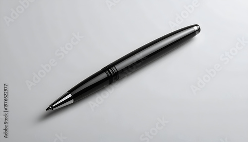 Black pen on gray background closeup.