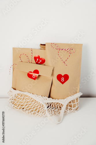 advent calendar recycled craft bags in string bag. eco-friendly and zero waste christmas concept