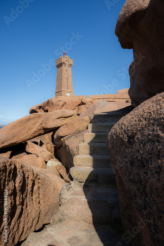 Phare Mean Ruz Lighthouse on the Coast of Atlantic ocean. landmarks in Ploumanach, Brittany, France. tourist attraction, travel destination