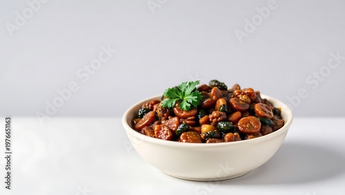Isolated feijoada in a round bowl with farofa and kale, set on a neutral gray background for product display, bright and clear lighting with detailed shadows and textures