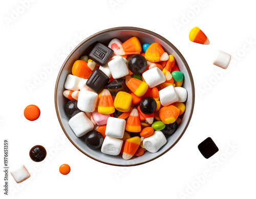 Colorful Halloween candy bowl and scattered sweets