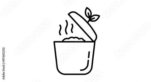 A steaming bowl with a leaf on the lid.
