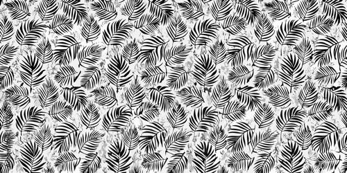 Intricate black and white seamless pattern of tropical palm leaves