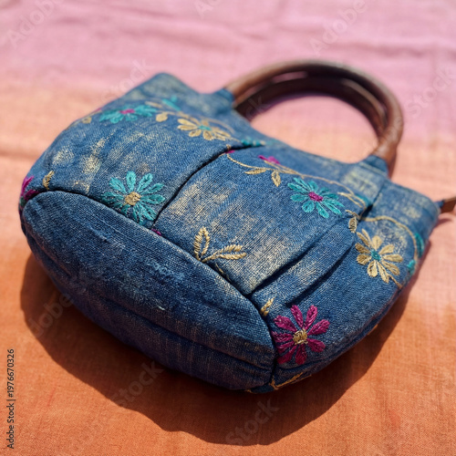 close-up of a vibrant blue bag with intricate stitching and a subtle sheen place