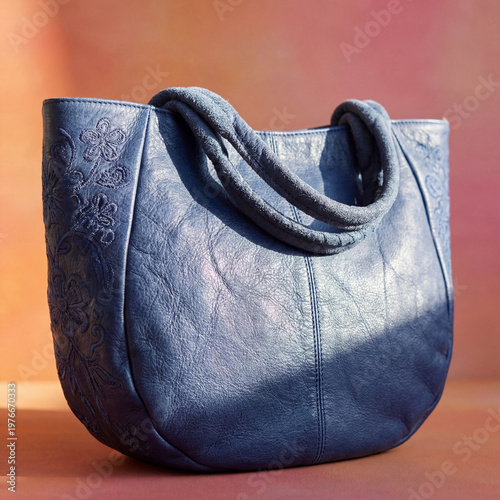 close-up of a vibrant blue bag with intricate stitching and a subtle sheen place