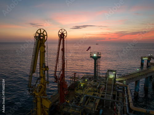 Aerial view of chemical plant with glowing lights and sunset sky in Nagda India
Drone shot of power plant with chimneys and evening lights in industrial city India