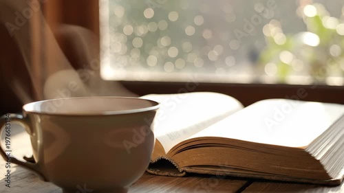 Closeup of Coffee Cup and Open Book with Sunlight