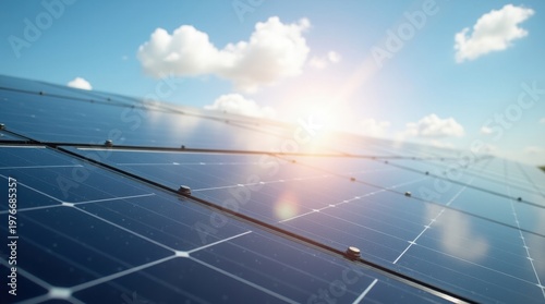 Rows of solar panels with sun shining through blue sky solar energy renewable