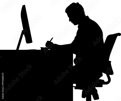 Silhouette of a man working at a desk with a computer monitor and writing with a pen