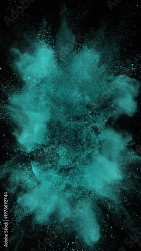 Turquoise powder explosion on black background