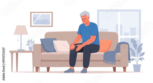 Elderly man suffering from knee pain while sitting on a sofa at home