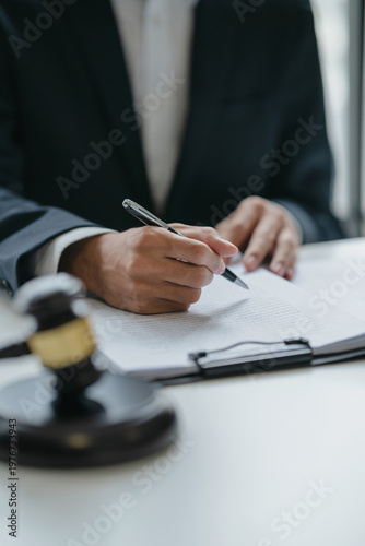 lawyer or judge counselor reading a important legal contract documents in office