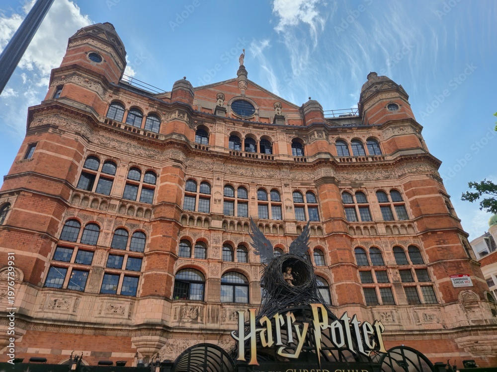 Fototapeta premium London, UK 03.07.2025 grand historic theater building facade with Harry Potter and the Cursed Child signage and iconic nest sculpture in London cultural district