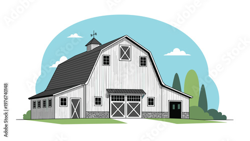 Classic white farmhouse barn with a gray roof and weather vane standing in a rural landscape with green trees and blue sky.