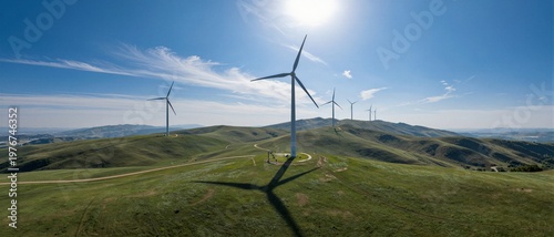 Wind turbines on green rolling hills for renewable energy and sustainable environmental growth